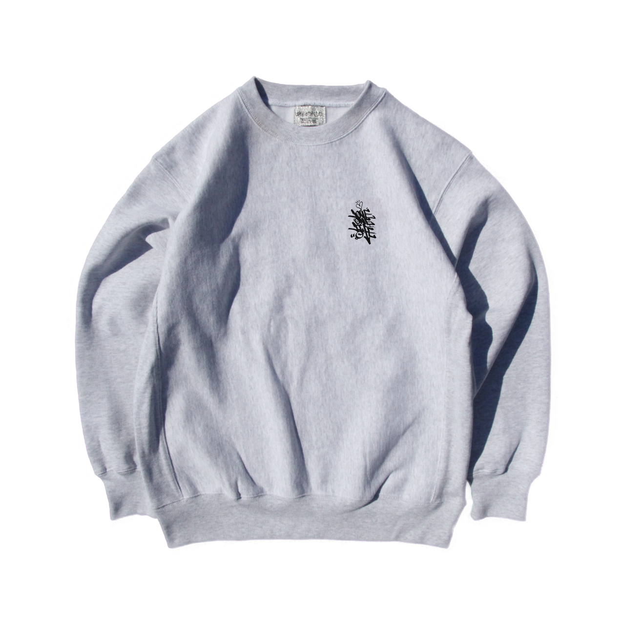 tagging reverse weave sweater in gray